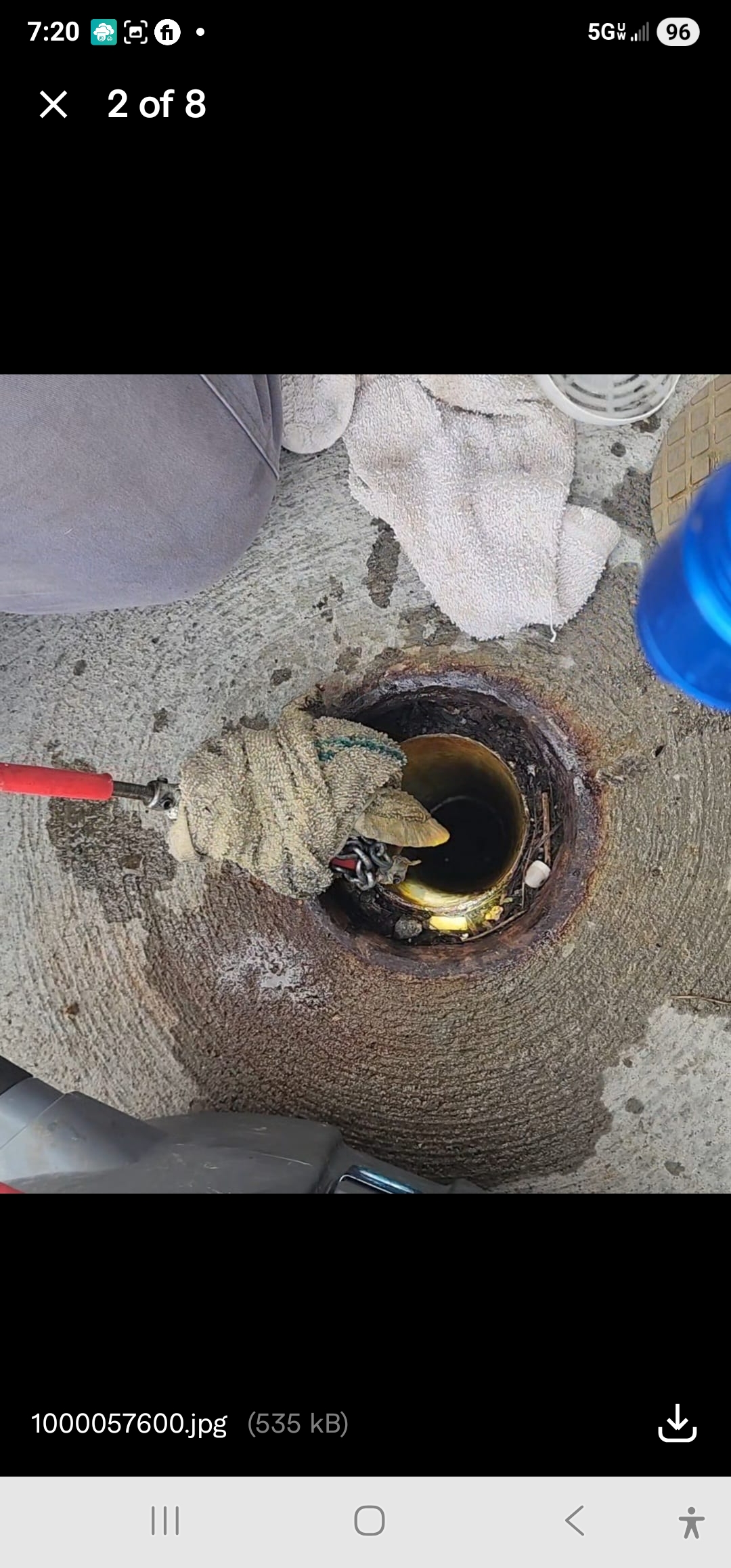 Drain cleaning machine clearing blocked floor drain in Pittsburgh