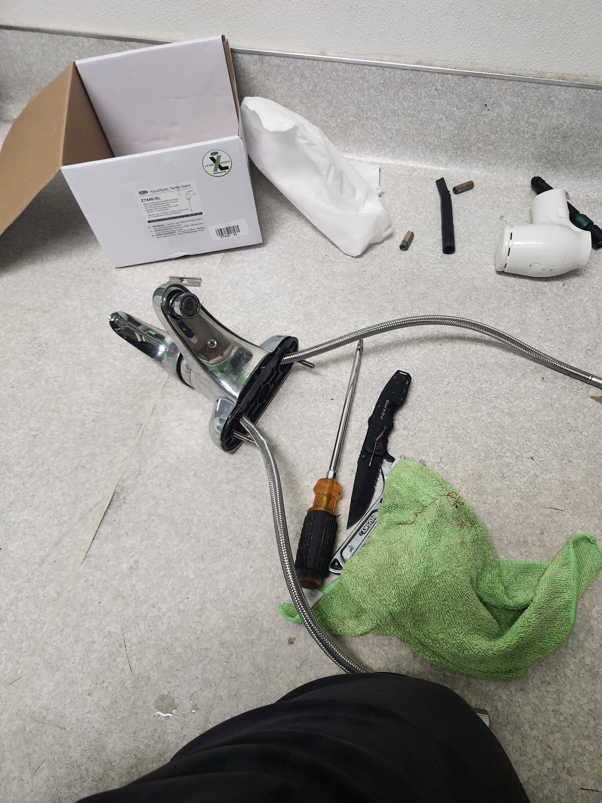 New commercial faucet and supply line laid out before installation