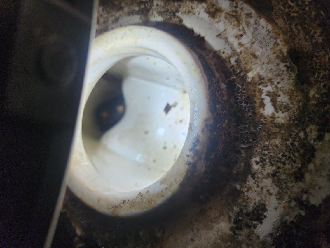 Buildup around an old drain opening