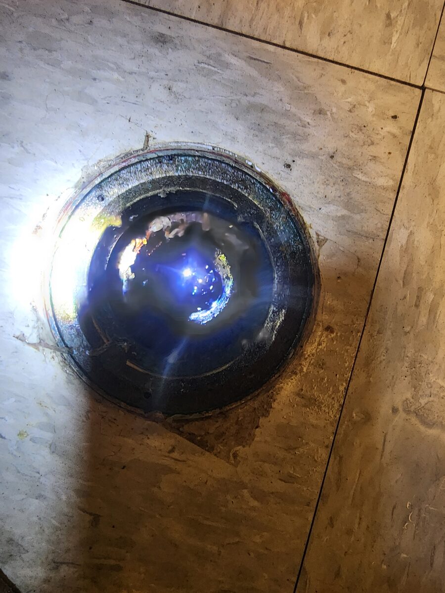 Drain line opened for cleaning