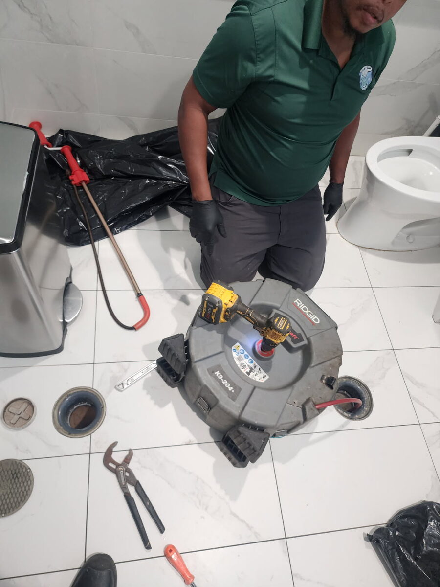 Floor drain being cleared with a RIDGID drain machine