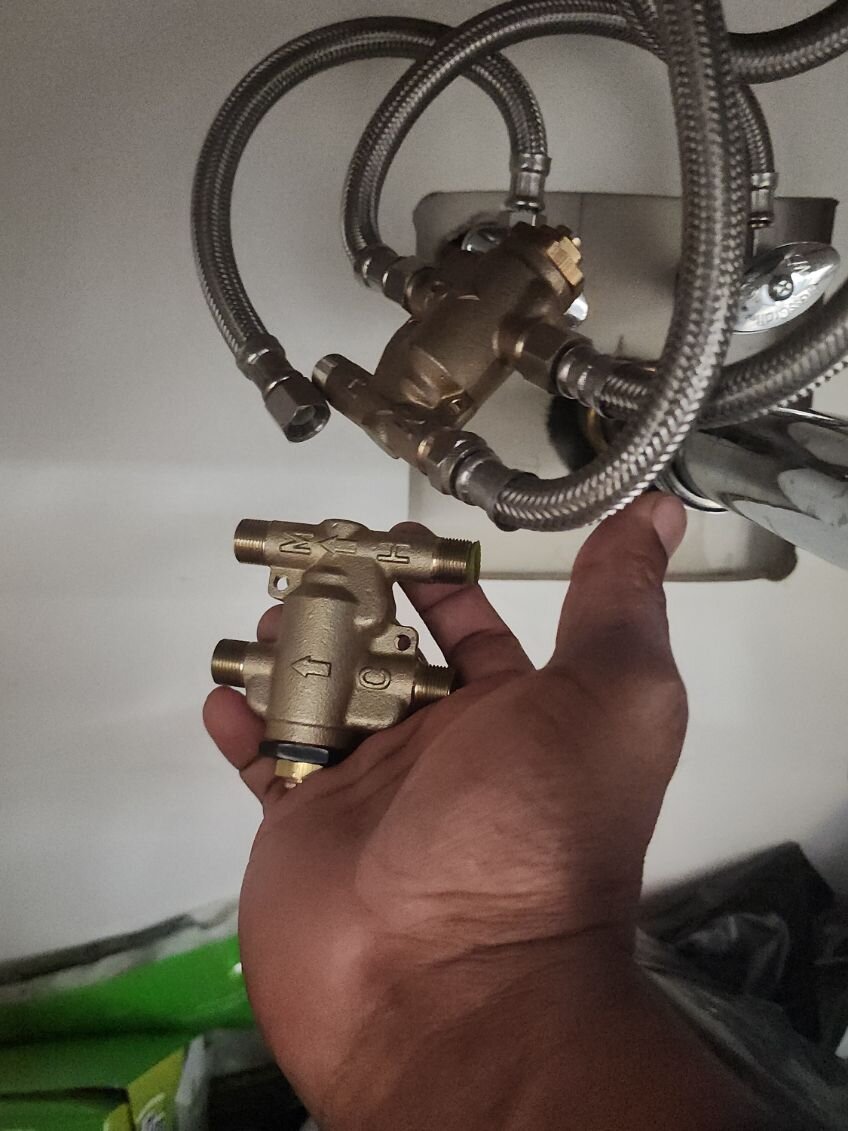 Replacing a mixing valve under a sink