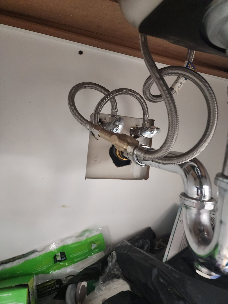 New mixing valve and supply lines installed under the sink