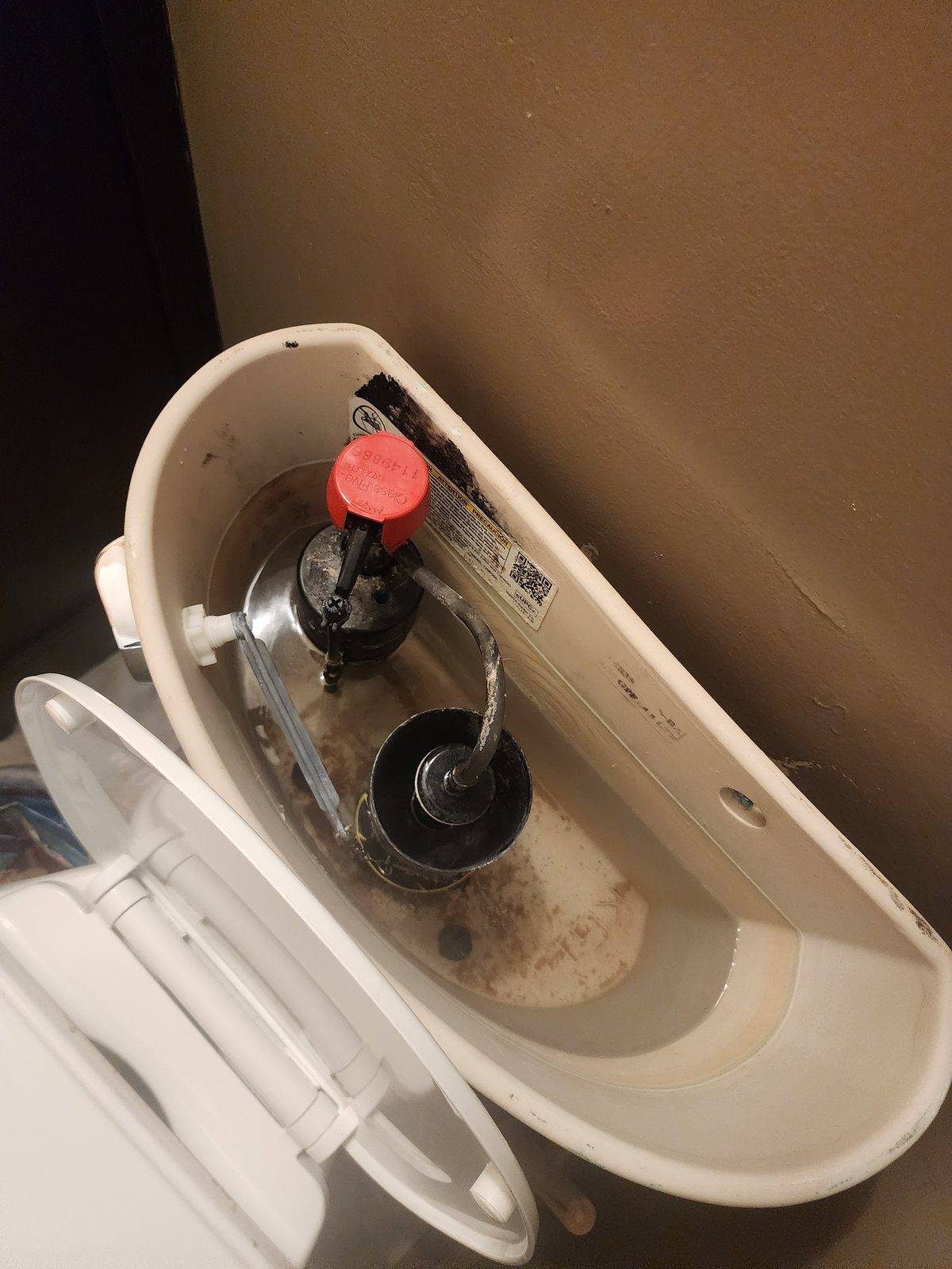 New fill valve and flush valve installed inside a toilet tank