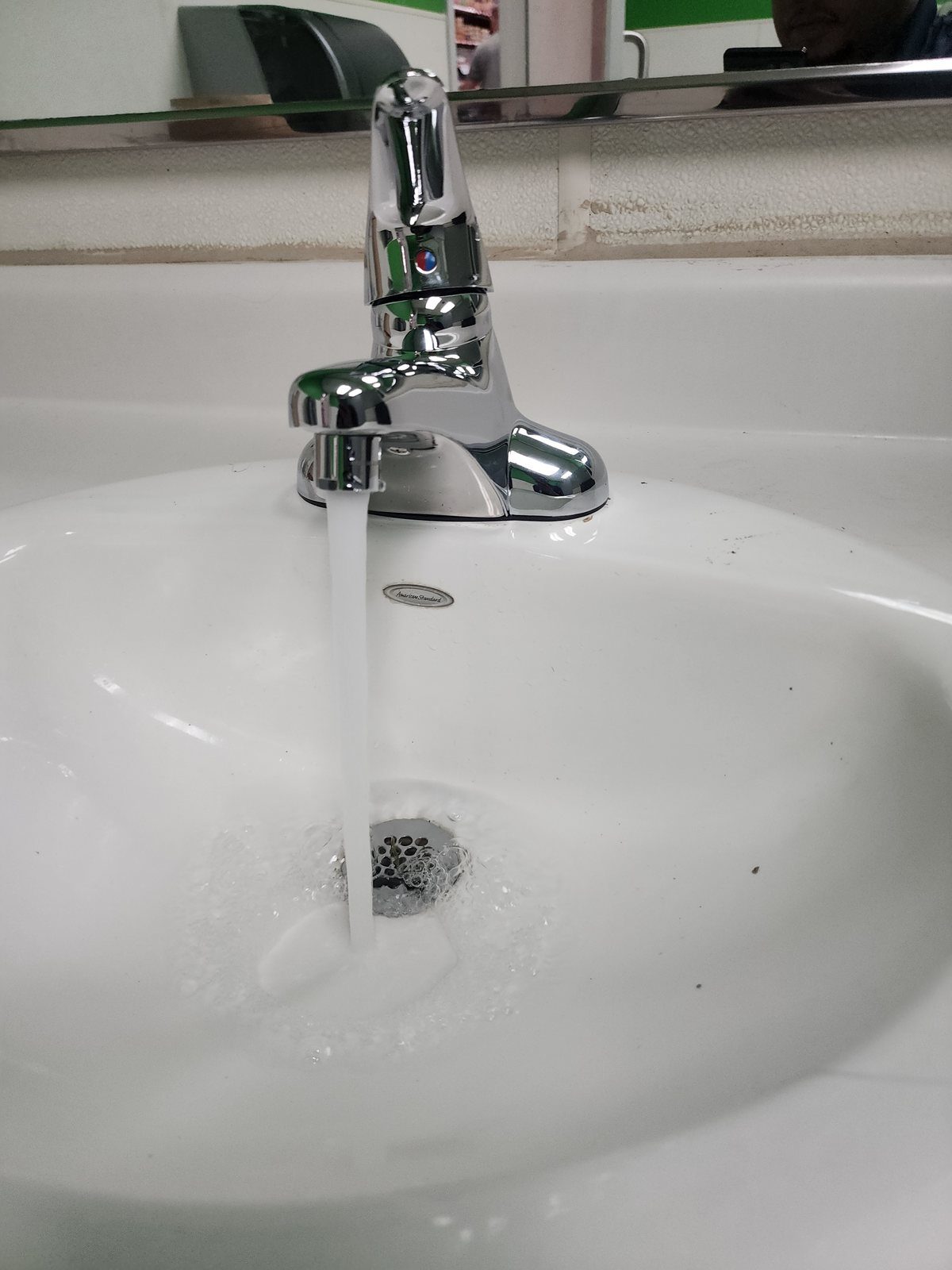 New chrome lavatory faucet installed and running
