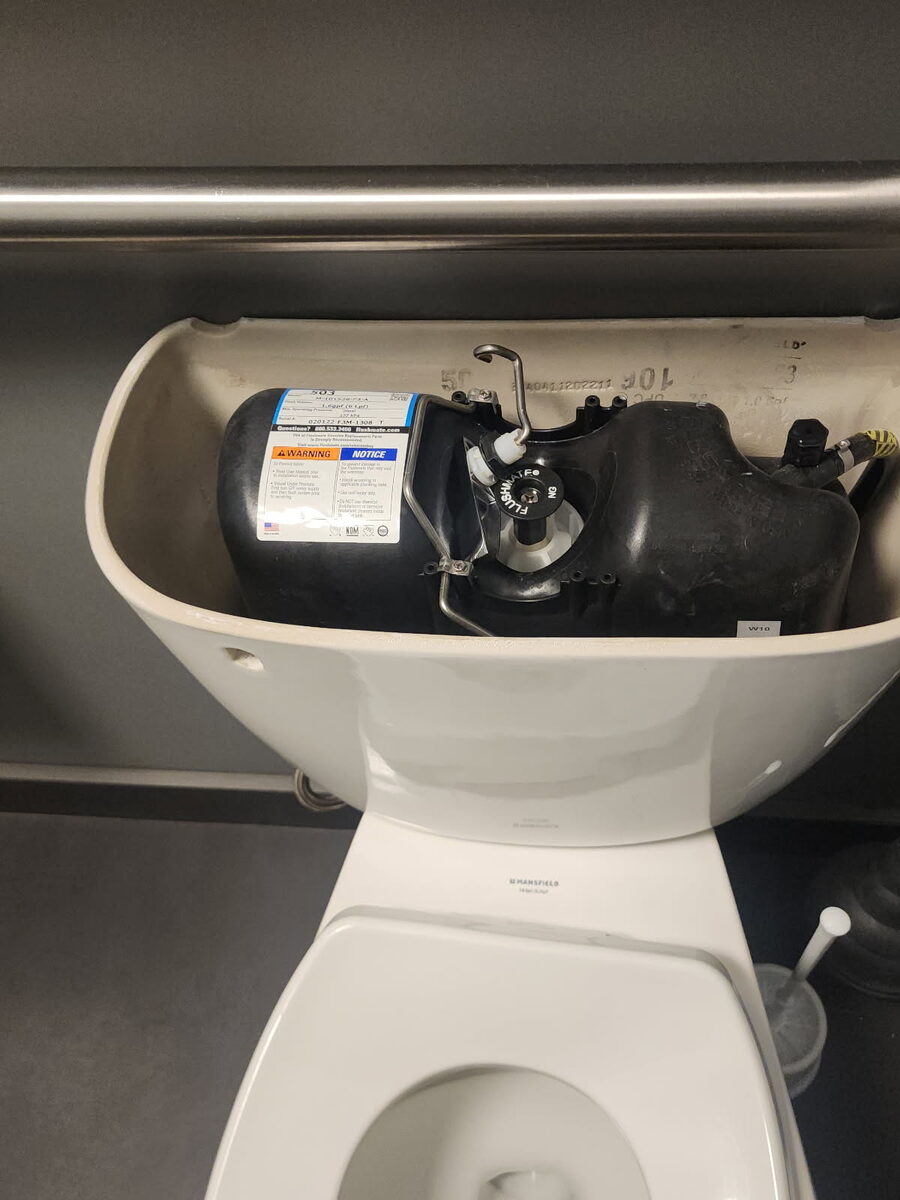 Pressure-assist flush system installed in a toilet tank