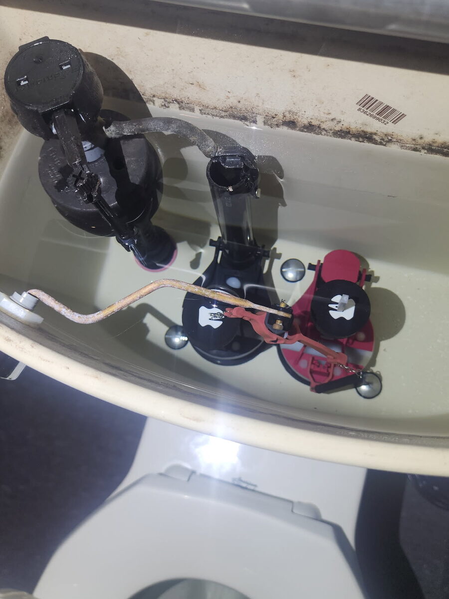 New fill valve and flush valve inside a toilet tank