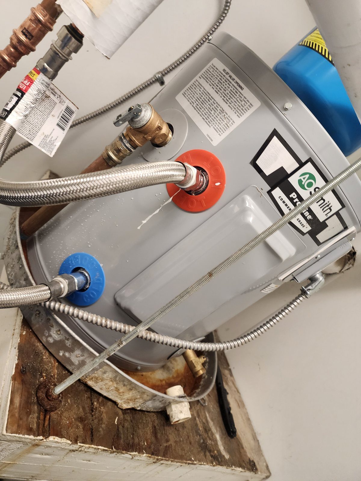Water heater hot and cold connections with temperature and pressure relief valve