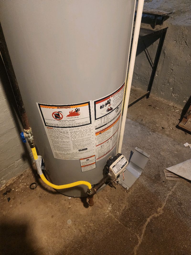 Gas water heater installed with yellow gas line in Pittsburgh PA basement